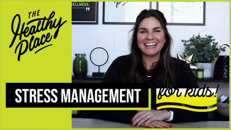 A video thumbnail from "The Healthy Place" featuring a smiling woman at a table with bold text reading "STRESS MANAGEMENT for kids!" and the brand’s logo on a lime green background.