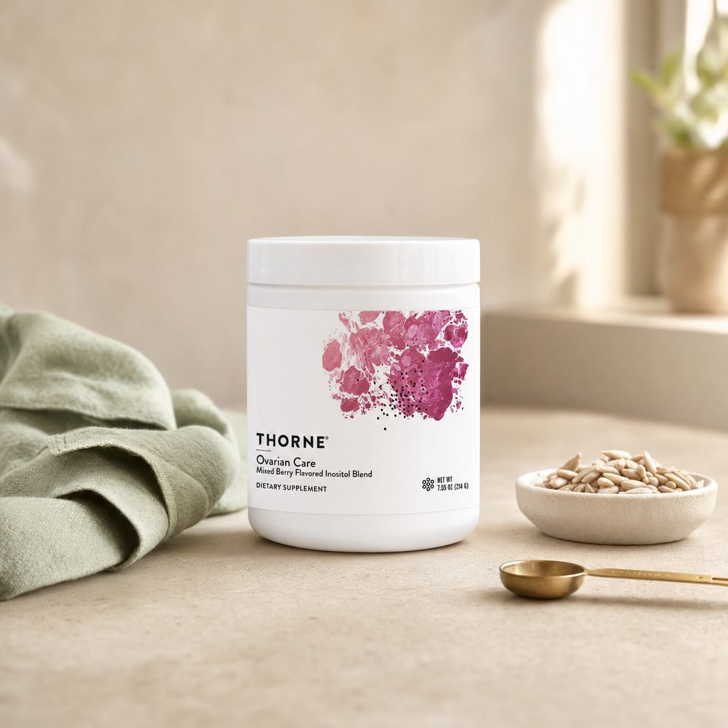 Thorne Research Ovarian Care Powder canister with mixed berry drink prepared nearby