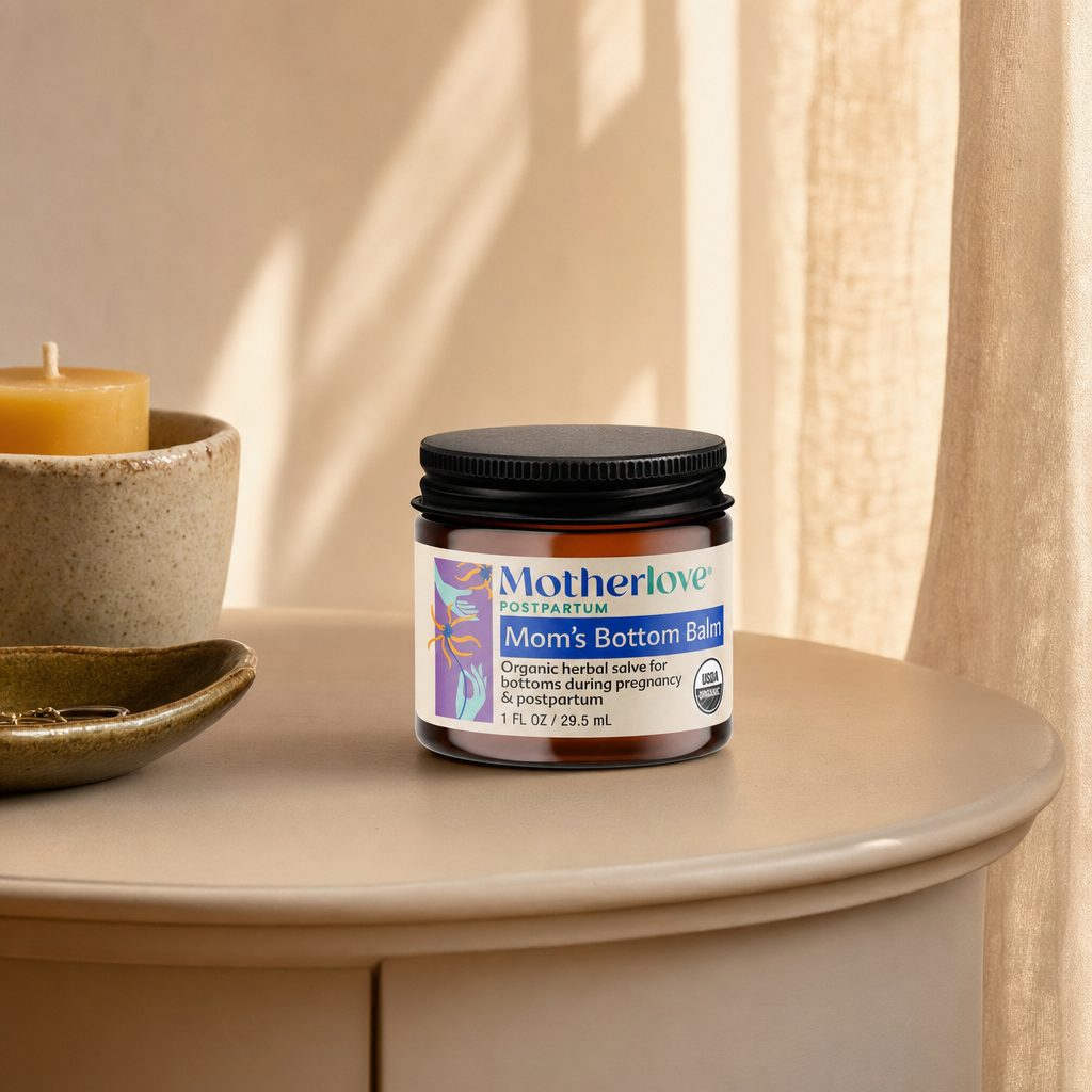 Motherlove Mom's Bottom Balm jar with balm texture and botanical postpartum care styling
