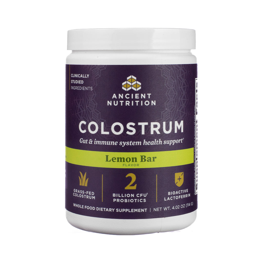 Front-facing view of Ancient Nutrition Colostrum Powder in Lemon Bar flavor, 60 servings container, with yellow-accented label, lemon imagery, and clean typography emphasizing gut and immune benefits.