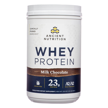 The front label of Ancient Nutrition Whey Protein Powder Milk Chocolate 22.8 oz shows the product's branding, highlighting 23g of protein per serving, A2/A2 milk protein, and grass-fed sourcing.