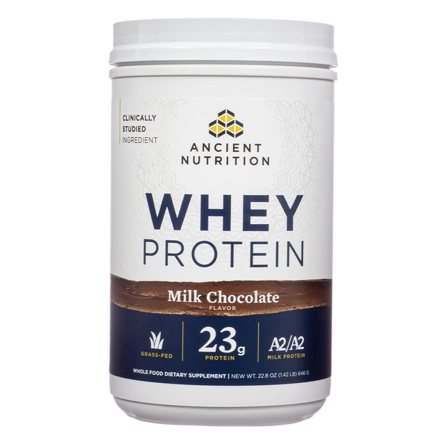 The front label of Ancient Nutrition Whey Protein Powder Milk Chocolate 22.8 oz shows the product's branding, highlighting 23g of protein per serving, A2/A2 milk protein, and grass-fed sourcing.