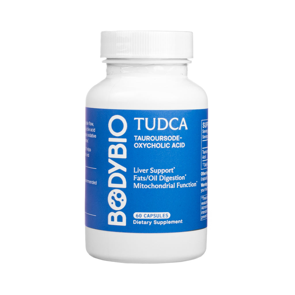 White bottle of BodyBio TUDCA dietary supplement with a bold blue label, featuring 60 capsules. Promotes liver support, fat and oil digestion, and mitochondrial function with tauroursodeoxycholic acid.