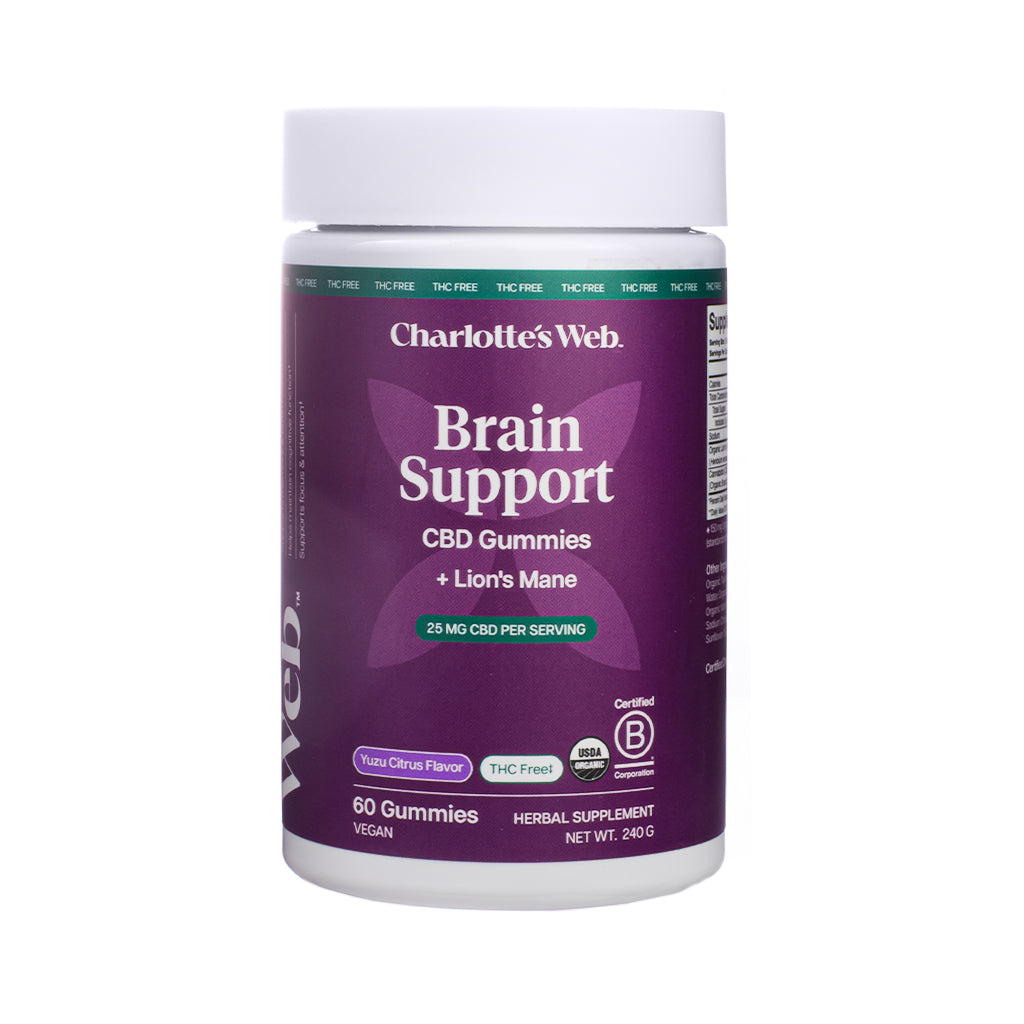 Tall purple and white jar of Charlotte’s Web Brain Support CBD Gummies with Lion’s Mane, offering 60 vegan gummies in Yuzu Citrus Flavor, 25 mg CBD per serving, and labeled THC Free.