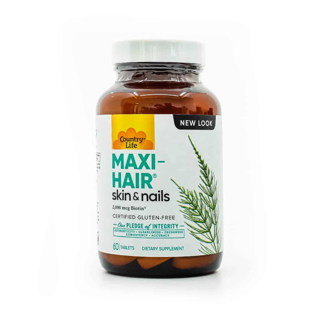 Bottle of Country Life Maxi-Hair Skin & Nails dietary supplement, containing 60 tablets. Promotes hair, skin, and nail health with 2,000 mcg of biotin and is certified gluten-free, with a “New Look” label on the top right.