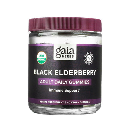 A clear jar of Gaia Herbs Black Elderberry Adult Daily Gummies with a deep purple lid and label. The product offers immune support with 40 vegan gummies and is labeled USDA Organic, containing 7g of fresh fruit per serving.