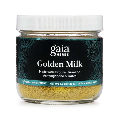 Gaia Herbs Golden Milk herbal supplement in a 4.3 oz (123 g) glass jar with a white lid, featuring a dark teal label. Made with organic turmeric, ashwagandha, and dates, this vegan and dairy-free powder supports wellness with traditional Ayurvedic ingredients.