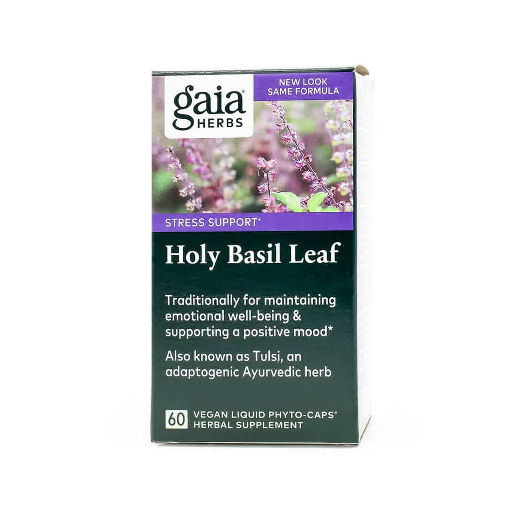 Front-facing box of Gaia Herbs Holy Basil Leaf supplement, featuring vibrant purple basil flowers on the top half and labeled for stress support. The packaging notes its traditional use for emotional well-being and mood support, with 60 vegan liquid phyto-caps per box.