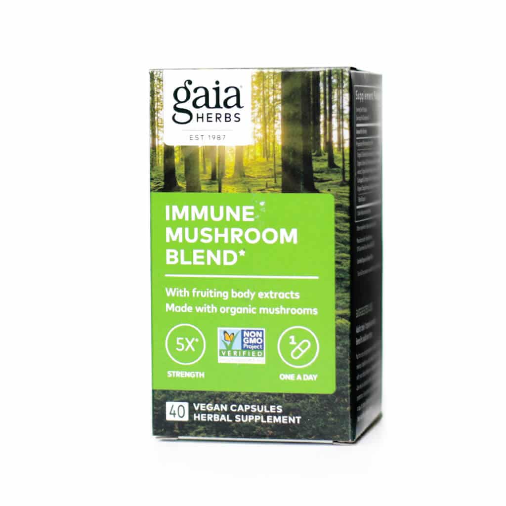 Box of Gaia Herbs Immune Mushroom Blend with forest imagery in the background and a bold green label. Highlights include 5x strength, made with organic mushroom fruiting body extracts, and 40 vegan capsules intended for daily immune support.