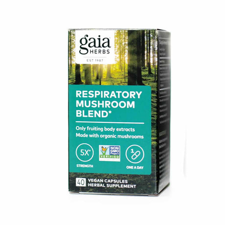 Box of Gaia Herbs Respiratory Mushroom Blend vegan capsules, featuring a forest-themed design. The label states it contains only fruiting body extracts made with organic mushrooms for respiratory support, with icons indicating 5X strength, Non-GMO certification, and a one-a-day dose.