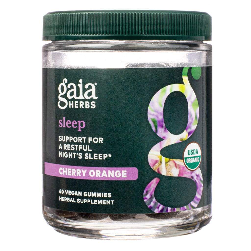 Glass jar of Gaia Herbs Sleep Gummies in cherry orange flavor, labeled to support a restful night's sleep. Features USDA Organic certification and includes 40 vegan herbal supplement gummies.