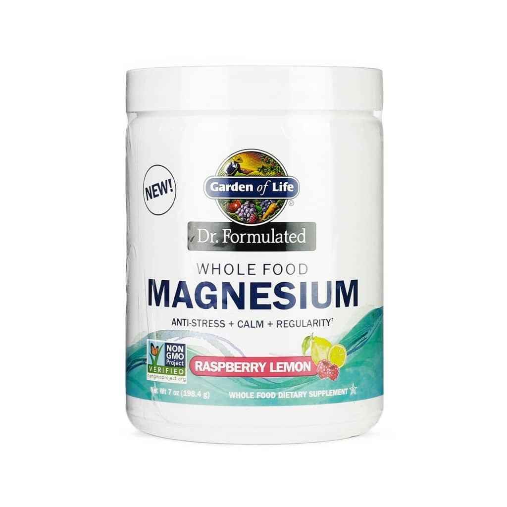 Garden of Life Dr. Formulated Whole Food Magnesium Powder in raspberry lemon flavor, packaged in a white plastic jar with a screw-on lid. The label highlights benefits such as anti-stress, calm, and regularity, and it is Non-GMO Project Verified. The design features a water splash, raspberries, and lemon slices, with a net weight of 421.5 grams (14.3 oz).