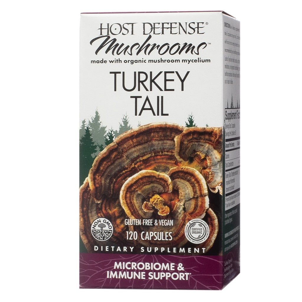Host Defense Mushrooms Turkey Tail, 120 Capsules. This microbiome and immune support supplement contains organic turkey tail mushroom mycelium. The packaging displays a large image of turkey tail mushrooms against a forest backdrop. Labels indicate that the product is gluten-free, vegan, non-GMO, and certified organic.