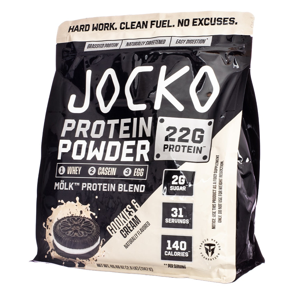 A black and cream-colored bag of Jocko Mölk protein powder showcasing a splashing image of a cookies and cream sandwich cookie. Contains 22g protein, 2g sugar, 140 calories per serving, and a three-protein blend from whey, casein, and egg.