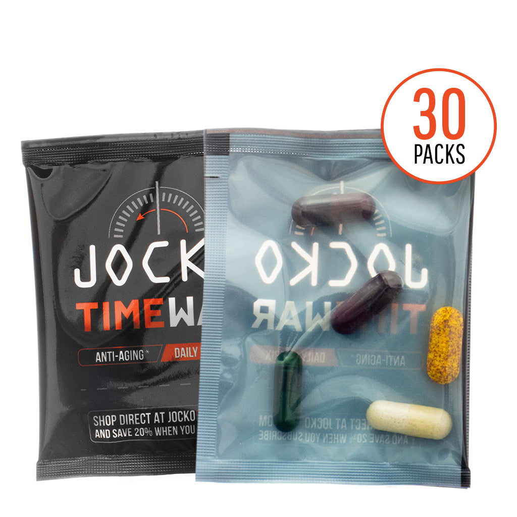 Close-up of a Jocko Time War supplement packet, showing five capsules of varying colors—black, dark green, yellow, white, and purple—inside a transparent sleeve. The packaging highlights "Anti-Aging," "Daily Matrix," and promotes a 30-pack count in bold red text.