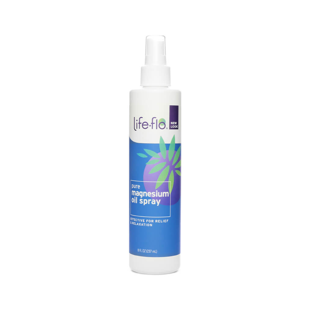 A tall white spray bottle of Life-Flo Pure Magnesium Oil Spray with a blue and purple label and green leaf design, labeled with "new look." This 8 fl. oz (237 mL) topical spray is intended for relief and relaxation, delivering pure magnesium directly to the skin.