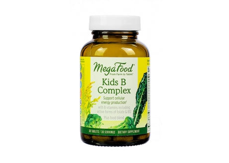 Amber glass bottle of MegaFood Kids B Complex dietary supplement featuring a yellow and green label with illustrations of kale, broccoli, and grains; contains 30 tablets designed to support cellular energy production with active B vitamins including folate and B12.