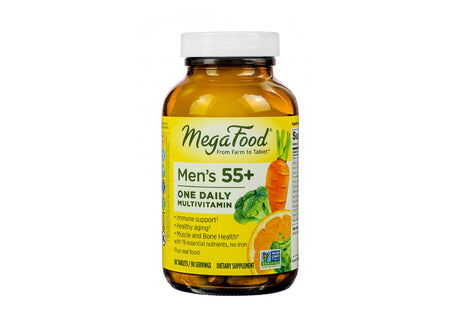 Amber bottle of MegaFood Men’s 55+ One Daily Multivitamin with 90 tablets. The label highlights support for immune health, healthy aging, and muscle and bone strength, featuring 19 essential nutrients without iron. The design includes illustrations of carrots, broccoli, and orange slices.
