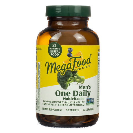 MegaFood Men’s One Daily Multivitamin in an amber glass bottle with a green cap, containing 90 tablets. Label features “21 nutrients plus real food” and promotes immune support, muscle health, bone health, and energy metabolism. The front shows images of broccoli, blueberries, and an orange slice.