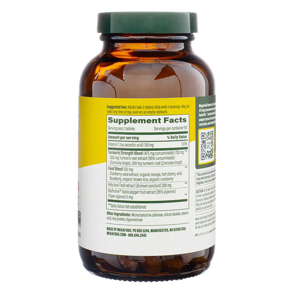 The supplement facts panel of MegaFood Turmeric Curcumin Extra Strength - Whole Body, 120 Tablets, detailing ingredients and dosage. It lists a serving size of two tablets, containing 475 mg of curcuminoids from turmeric extract and root, along with BioPerine® black pepper extract for absorption. The label also highlights a food blend including cranberry, orange, and wild blueberry extracts.