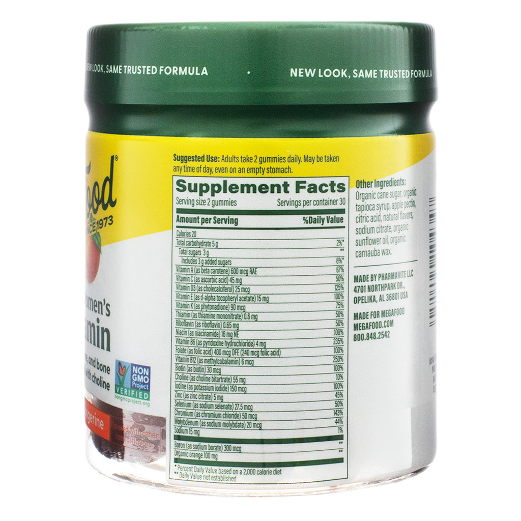 The supplement facts panel of MegaFood Women’s Multivitamin Gummies, 60-count, Tangerine flavor, listing vitamins, minerals, and other ingredients. The label details a serving size of two gummies, with key nutrients like vitamin A, vitamin D, B vitamins, zinc, and iodine. The product is made with organic cane sugar, tapioca syrup, and real fruit flavors.