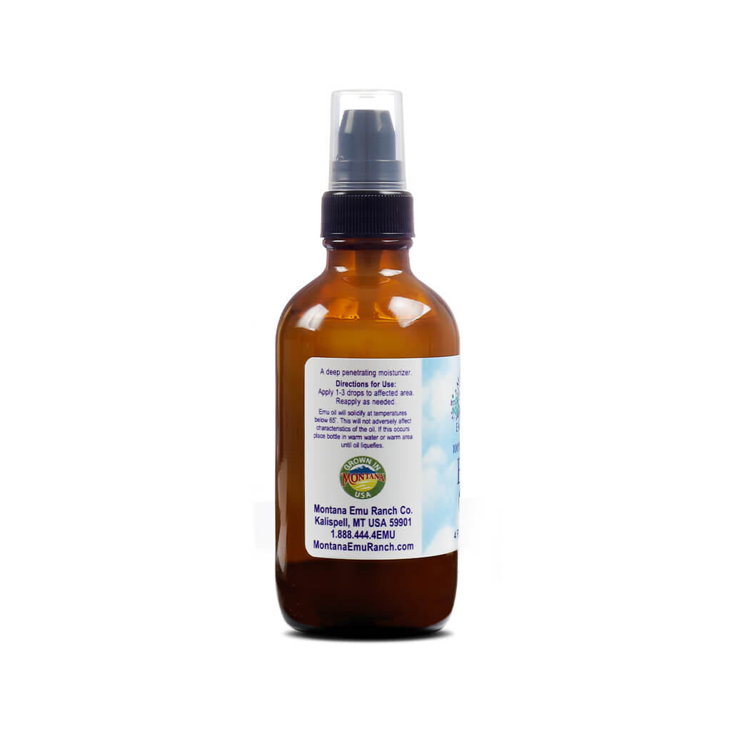 Back of a brown spray bottle of Montana Emu Oil showing usage instructions and contact details. Text states it is a deep penetrating moisturizer and gives directions to apply 1–3 drops to affected areas, along with company information from Kalispell, Montana.