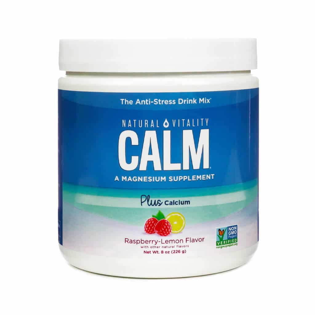 A container of Natural Vitality CALM Plus Calcium in raspberry-lemon flavor, an anti-stress magnesium supplement drink mix. The label shows raspberries and a lemon slice, with a Non-GMO Project Verified seal.
