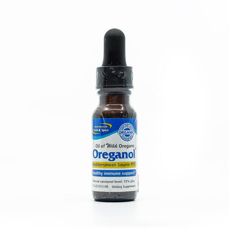 Dropper bottle of North American Herb & Spice Oreganol, a dietary supplement made with oil of wild oregano, labeled as Mediterranean Source P73 for healthy immune support. The bottle notes a natural carvacrol level of 73%+ and contains 13.5 mL of organic formula.