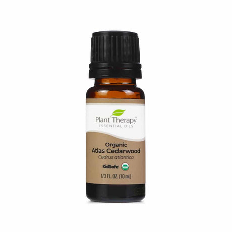 A small amber bottle of Plant Therapy organic cedarwood essential oil,  10 ml 1/3 fluid ounce, 
 with a warm brown label, designed for aromatherapy use.