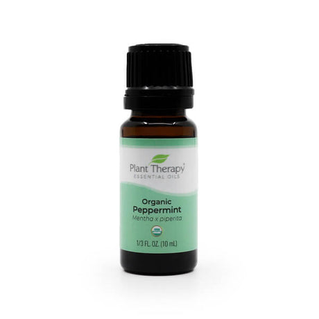 Plant Therapy Organic Peppermint Essential Oil, 10 mL bottle. The dark amber glass bottle has a black cap and a light green and white label featuring the USDA Organic seal. This refreshing essential oil is derived from Mentha x piperita and is known for its invigorating scent.