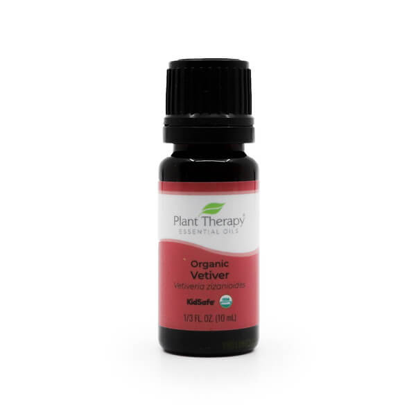 A 10 ml / 1/3 fluid ounce amber glass bottle of Plant Therapy Organic Vetiver Essential Oil with a black cap. The label features a red and white design with the brand's green leaf logo, indicating that the product is USDA Organic and KidSafe. The text on the label reads 'Organic Vetiver' and 'Vetiveria zizanioides.'