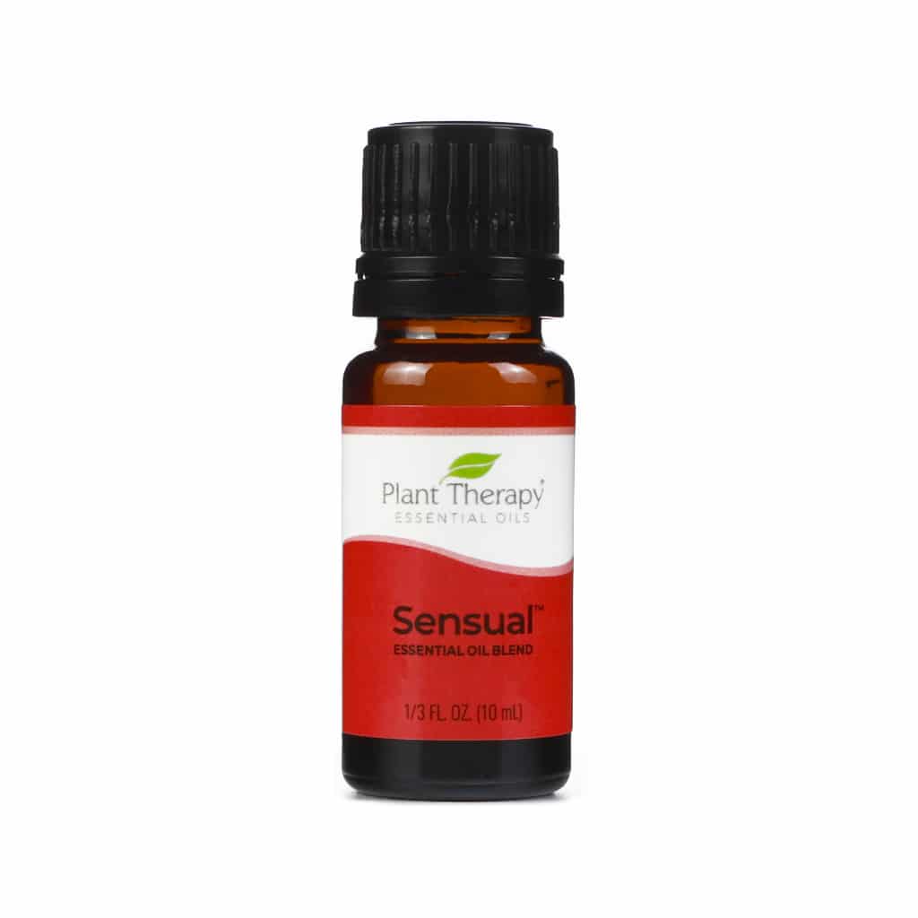 Plant Therapy Sensual Essential Oil Blend, 10 mL bottle. The amber glass bottle has a black cap and a red and white label featuring the Plant Therapy logo and the word "Sensual" in bold text. This blend is designed to create a warm and romantic atmosphere.