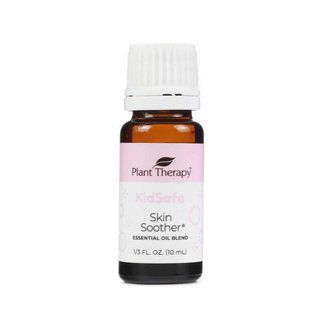 Plant Therapy Skin Soother KidSafe Essential Oil Blend, 10 mL bottle. The amber glass bottle has a white cap and a soft pink and white label with subtle bubble illustrations. Designed to help calm and support irritated skin, part of Plant Therapy's KidSafe line.