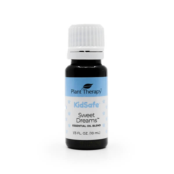 Plant Therapy Sweet Dreams KidSafe Essential Oil Blend, 10 mL bottle. The amber glass bottle has a white cap and a blue and white label with small star illustrations. Designed to promote relaxation and restful sleep, part of Plant Therapy's KidSafe line.