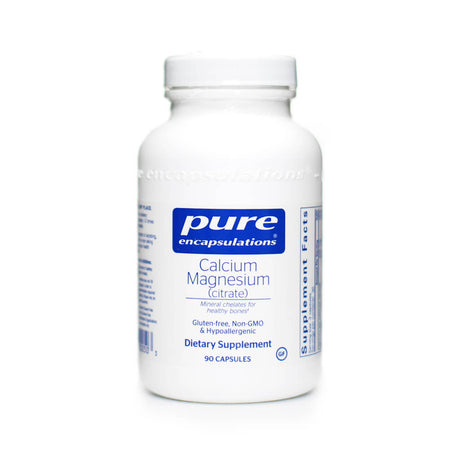 White bottle of Pure Encapsulations Calcium Magnesium (citrate) dietary supplement with a blue and white label. Contains 90 capsules featuring mineral chelates to support healthy bones, labeled gluten-free, non-GMO, and hypoallergenic.