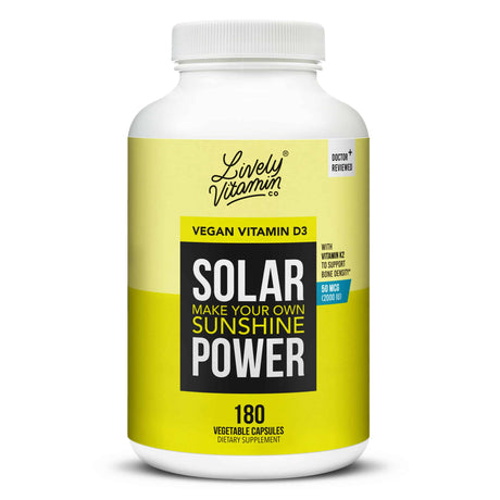 A large white bottle of Lively Vitamin Co. Solar Power vegan vitamin D3 supplement with a bright yellow label that reads “Make your own sunshine – with Vitamin K2 to support bone density,” containing 180 vegetable capsules and labeled “Doctor Reviewed.”