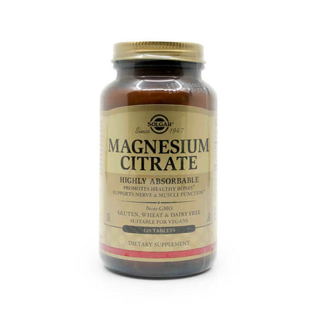 Solgar Magnesium Citrate dietary supplement in a brown glass bottle with a gold screw-on cap. The beige and gold label highlights that the product is highly absorbable, promotes healthy bones, and supports nerve and muscle function. It is labeled as non-GMO, gluten-free, wheat-free, dairy-free, and suitable for vegans. The bottle contains 120 tablets.