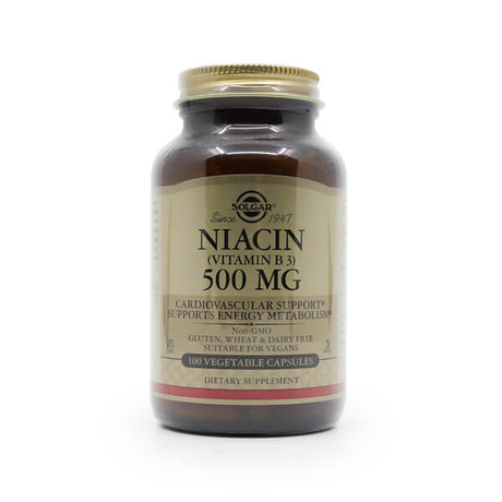 A brown glass bottle of Solgar Niacin (Vitamin B3) 500 mg dietary supplement, labeled for cardiovascular support and energy metabolism. The front label states it's non-GMO, gluten-, wheat-, and dairy-free, suitable for vegans, and contains 100 vegetable capsules.