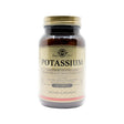 A brown glass bottle of Solgar Potassium dietary supplement. The label notes benefits for nerve and muscle health, electrolyte balance, and highlights that it is non-GMO, gluten, wheat, and dairy free, and suitable for vegans with 100 tablets per bottle.