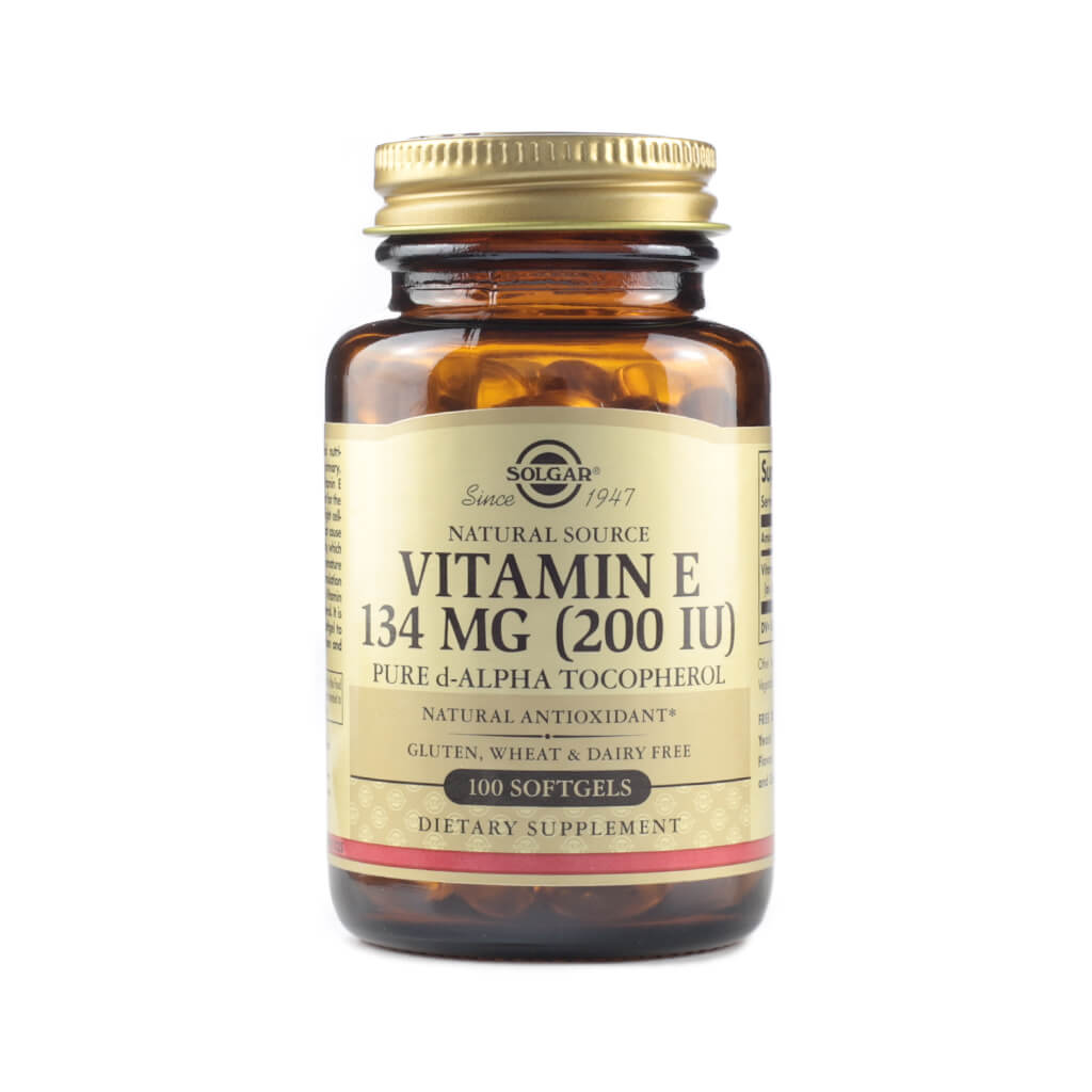 Amber glass bottle of Solgar Natural Source Vitamin E, containing 134 mg (200 IU) of pure d-alpha tocopherol in softgel form. The label highlights that it’s a natural antioxidant and free from gluten, wheat, and dairy, with 100 softgels per bottle.