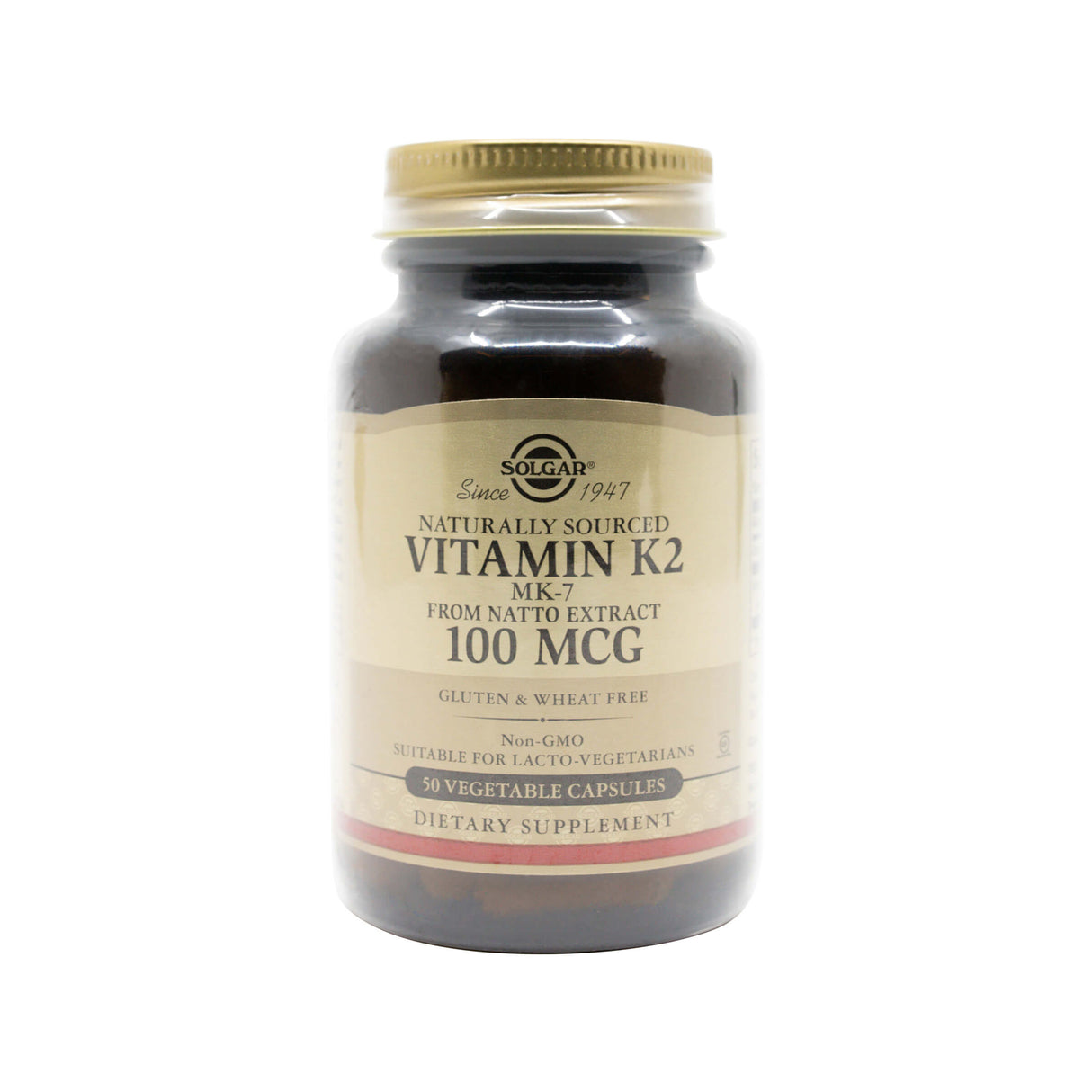 Dark amber bottle of Solgar Vitamin K2 MK-7, labeled “Naturally Sourced from Natto Extract, 100 MCG.” The label highlights key features including gluten and wheat free, non-GMO, suitable for lacto-vegetarians, and contains 50 vegetable capsules.