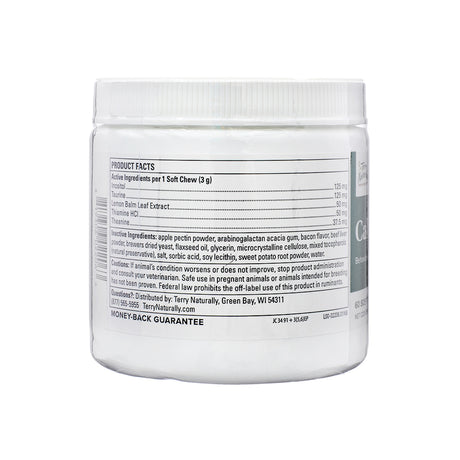 Back of Terry Naturally Calm Chew container showing the Product Facts label. The active ingredients listed include Inositol, Taurine, Lemon Balm Leaf Extract, Thiamine HCl, and Theanine. The label also details inactive ingredients such as apple pectin powder, flaxseed oil, and bacon flavor. The caution statement advises consulting a veterinarian if the animal's condition worsens and notes safe use in pregnant or breeding animals has not been proven. A money-back guarantee is printed at the bottom.