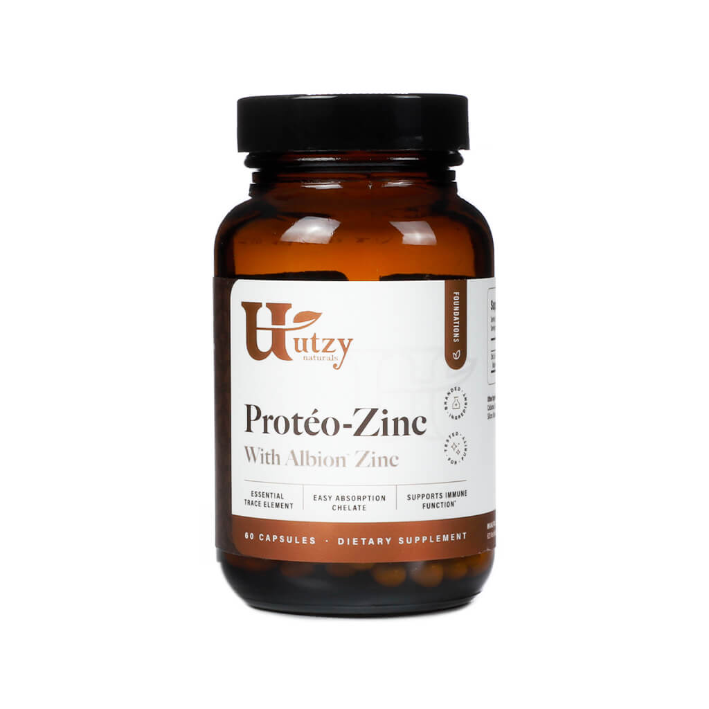 Amber bottle of Utzy Naturals Protéo-Zinc featuring Albion Zinc, labeled as an essential trace element with easy absorption chelate. The supplement supports immune function and contains 60 capsules.