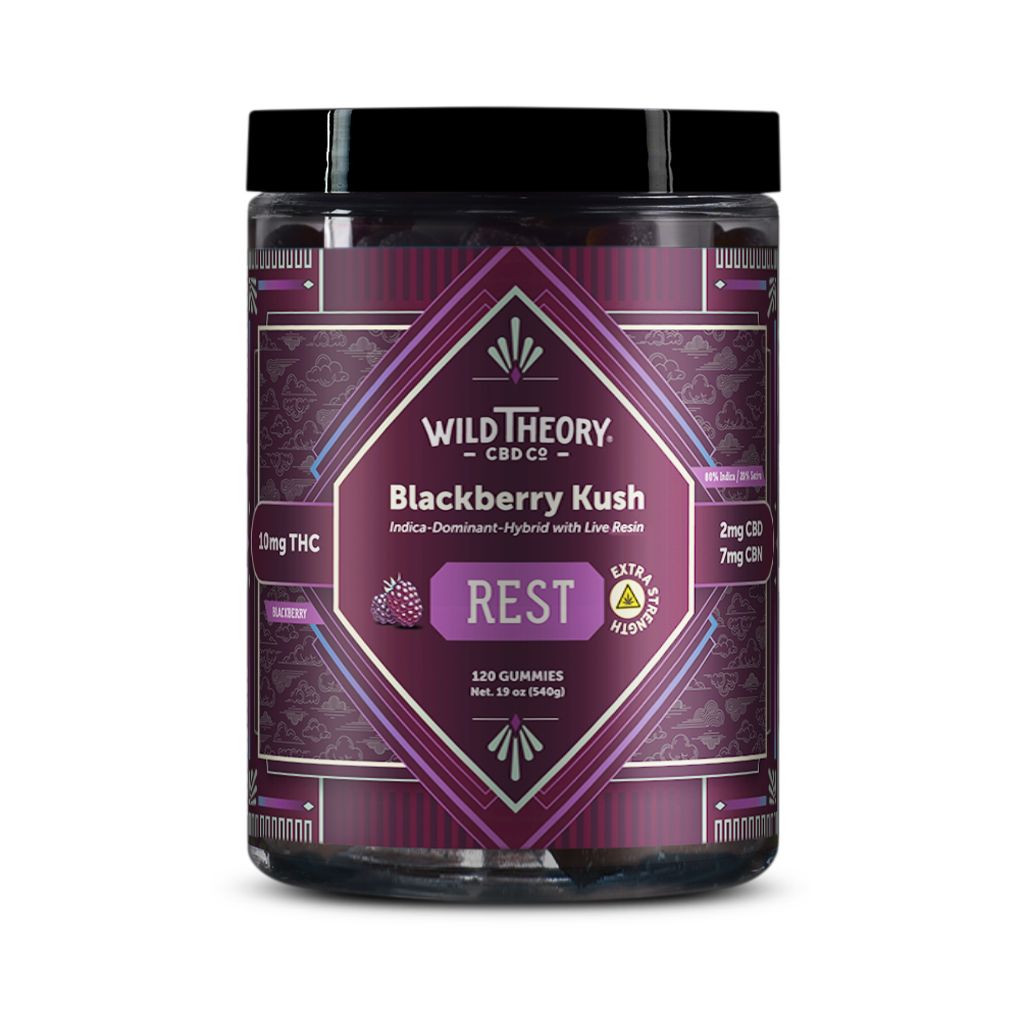 Wild Theory Blackberry Kush REST 10mg THC Gummies 120 Gummies, front label view. The jar features a deep purple geometric design with the Wild Theory CBD Co. logo and “Blackberry Kush – Indica-Dominant Hybrid with Live Resin.” It highlights 10 mg THC per gummy, 2 mg CBD, and 7 mg CBN, with a central “REST” label indicating relaxation support. The label shows 120 gummies, blackberry imagery, and an extra strength symbol.