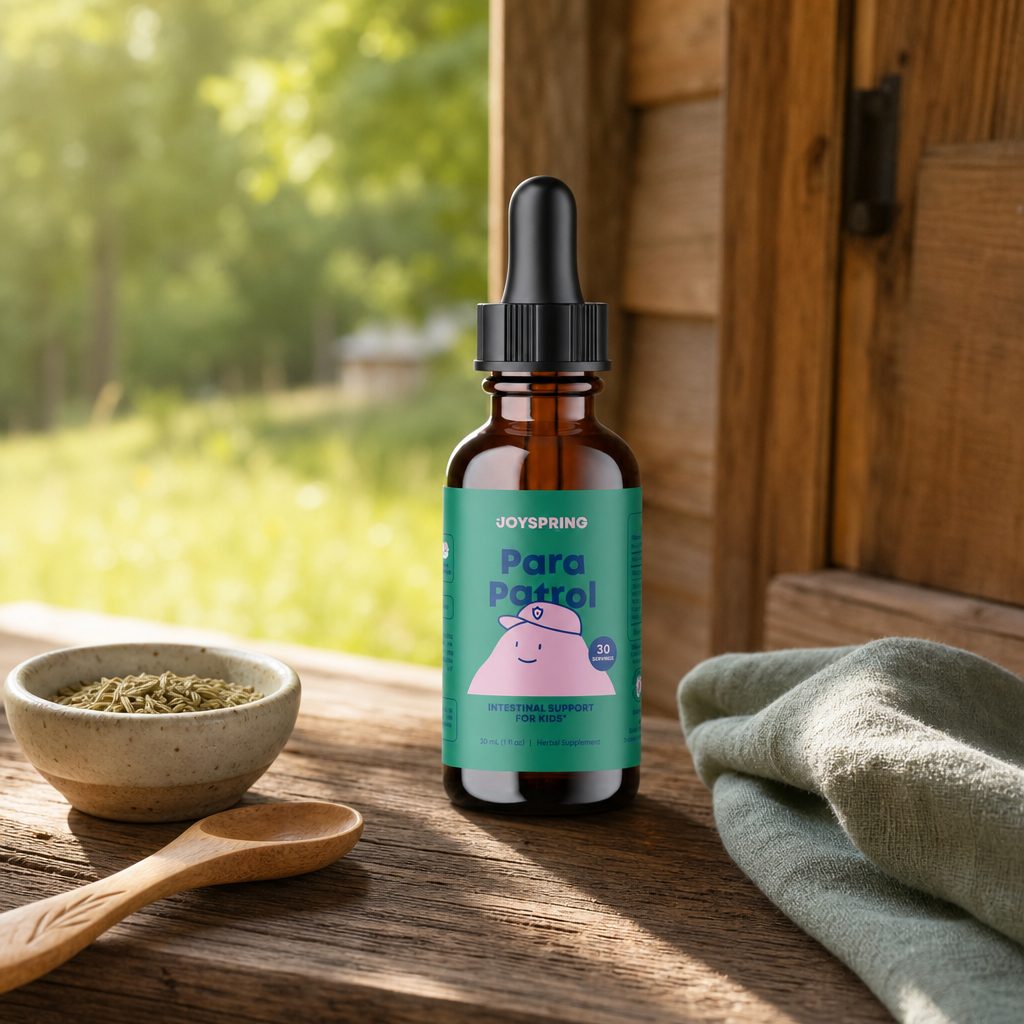 JoySpring ParaPatrol Drops shown with dropper and liquid serving for mixing into a child’s routine