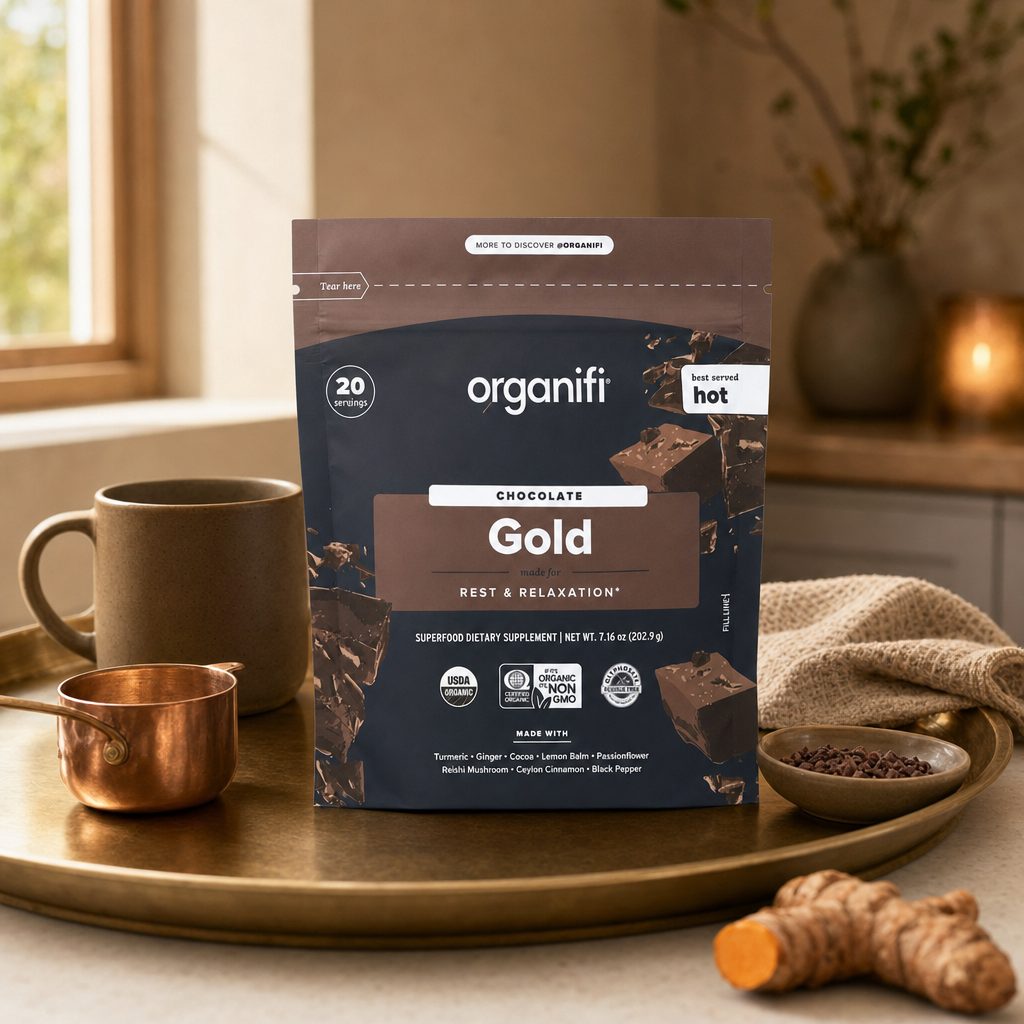 Organifi Gold Superfood Powder Chocolate served as a warm cocoa-style drink in a mug