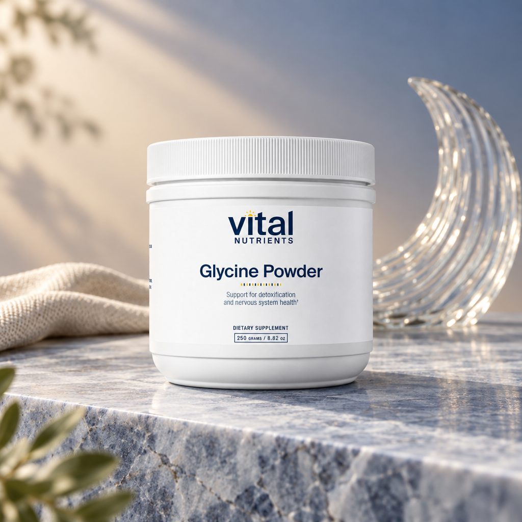 Vital Nutrients Glycine Powder container on a marble ledge beside a glass crescent moon and a towel