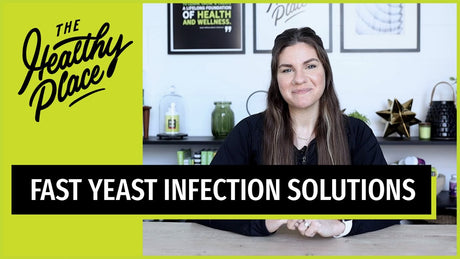 Smiling woman in a 'Find Your Healthy Place' jacket sits at a table with a wellness-themed background. Bold text reads 'FAST YEAST INFECTION SOLUTIONS.'"