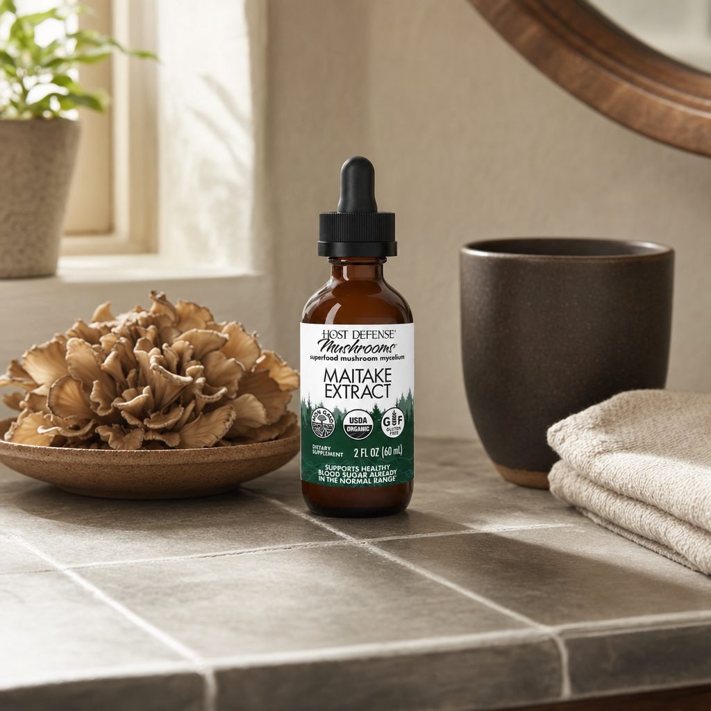 Host Defense Maitake Extract 2 fl oz dropper bottle shown in a wellness routine scene