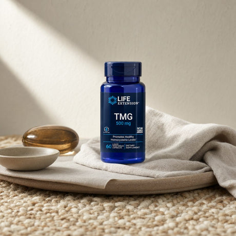 Life Extension TMG 500 mg bottle beside water glass in a morning supplement setup